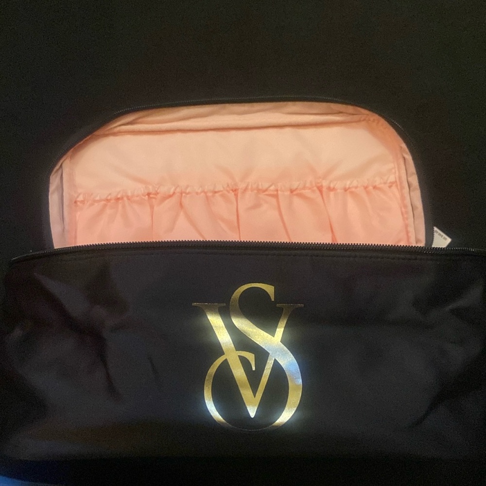 Black and pink Victoria’s Secret travel bag